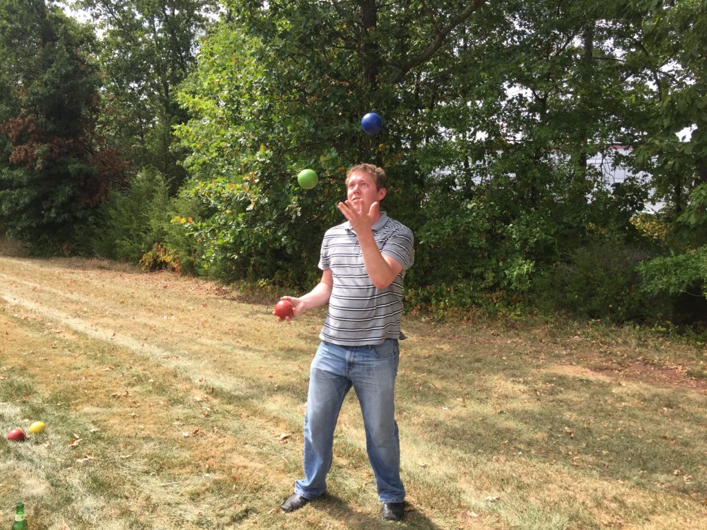 Chris juggles at the R&J barbeque